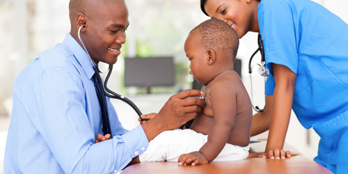 Doctor giving an infant a check-up