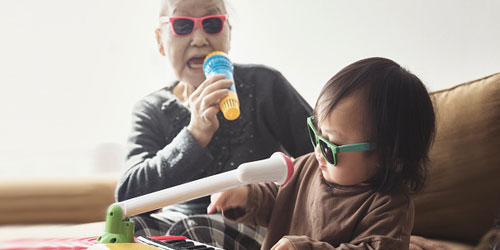 Toddler playing with grandmother