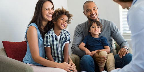 A young family meeting with a health care professional